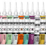 Close‑up of Pentart Contour Liner 20ml bottles in multiple colours arranged in a neat row for craft and mixed‑media projects.