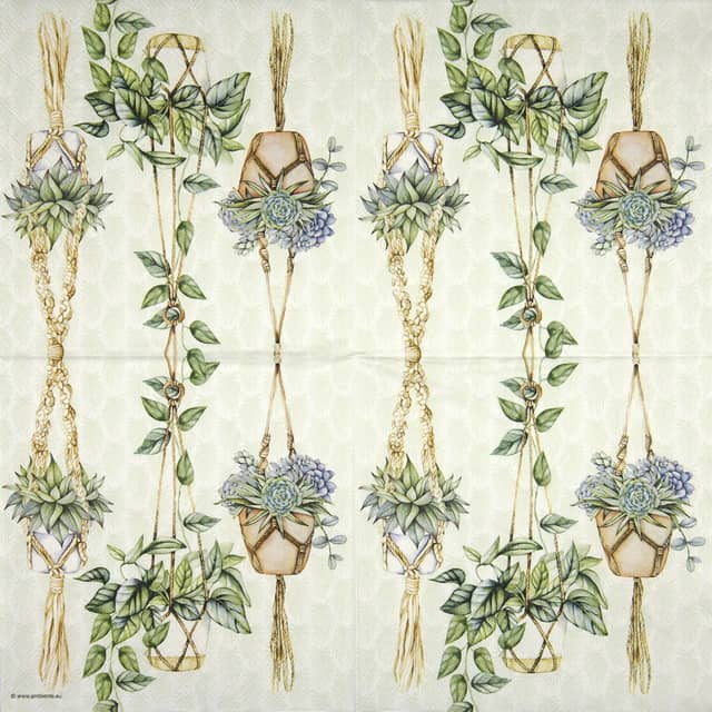 a paper napkin with a pattern of plants and leaves