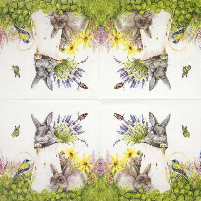 a paper napkin with a rabbit and flowers