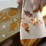 Using Pentart 3D Glue Pen to apply decorative gold foil on a mixed media project