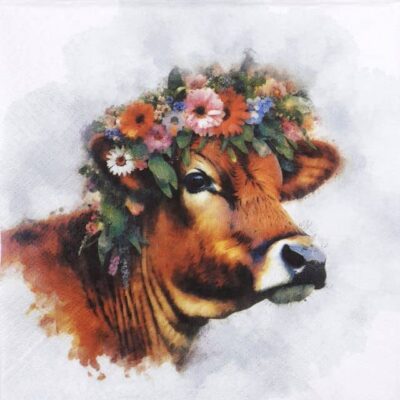 Close-up detail of the Muh cow napkin showing a brown cow wearing a colorful floral crown.