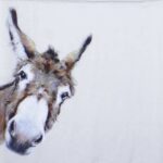 Close-up detail of the Donkey Gonzo grey decoupage napkin showing a painted donkey head