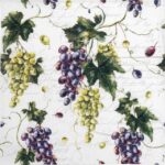 Close-up detail of the Vignes and Feuilles decoupage napkin showing purple grapes and vintage script
