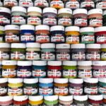 Selection of different Pentart matte acrylic paint colours displayed on a palette, showing the smooth, opaque finish of the 50ml jars.