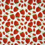 Full view of the strawberry napkins for party decor, showing the complete repeating fruit pattern