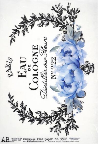AB Studio Decoupage Rice Paper A/4 - Perfume Label Blue Flowers - 5367. A vintage Paris Eau de Cologne label with black typography, a laurel wreath, and soft blue flowers at the bottom