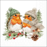 Two robins wearing knitted winter hats and a scarf sitting on a snowy branch with berries, cotton, mushrooms and a pine cone.