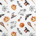 Close-up detail of the Happy Halloween napkin showing pumpkins, ghosts, bats, witch hats, and brooms on a white background.